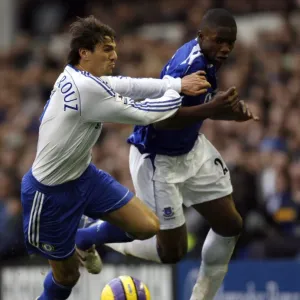 Evertons Anichebe is held back by Chelseas Boulahrouz during their English Premier League soccer m Evertons Anichebe is held back by Chelseas Boulahrouz during their English Premier League soccer m