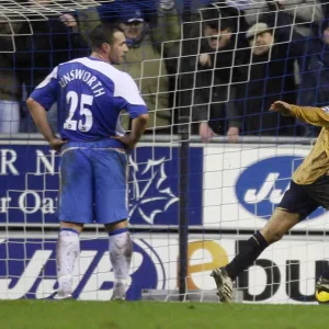 Evertons Arteta celebrates after scoring as Wigan Athletics Unsworth looks on during their English