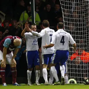Everton's Double Delight: Celebrating the Second Goal Against West Ham United in the Barclays Premier League (December 22, 2012, Upton Park)