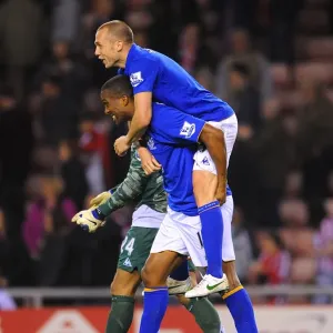 Everton's FA Cup Triumph: Heitinga and Distin's Jubilant Moment at Sunderland's Stadium of Light (March 2012) Everton's FA Cup Triumph: Heitinga and Distin's Jubilant Moment at Sunderland's Stadium of Light (March 2012)