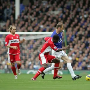 Everton's Ferguson Shields the Ball from Boateng: A Football Intense Moment Everton's Ferguson Shields the Ball from Boateng: A Football Intense Moment