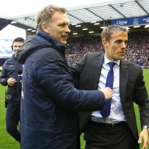 Everton's Glorious Moment: Moyes and Neville's Embrace during Victory Parade (2-0 Win over West Ham, May 12, 2013) Everton's Glorious Moment: Moyes and Neville's Embrace during Victory Parade (2-0 Win over West Ham, May 12, 2013)