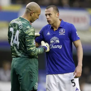 Everton's Howard and Heitinga Deep in Tactical Discussion at Goodison Park during Everton vs Chelsea (11 February 2012) Everton's Howard and Heitinga Deep in Tactical Discussion at Goodison Park during Everton vs Chelsea (11 February 2012)