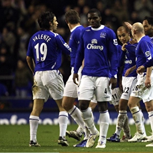 Evertons James Vaughan celebrates with his team mates after scoring his teams second goal