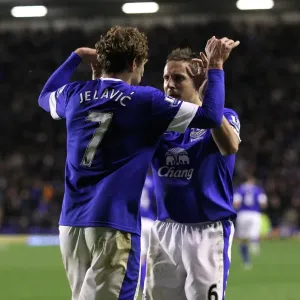 Everton's Jelavic and Jagielka: A Celebratory Moment as Everton Takes a 2-1 Lead Over Tottenham (December 9, 2012, Goodison Park) Everton's Jelavic and Jagielka: A Celebratory Moment as Everton Takes a 2-1 Lead Over Tottenham (December 9, 2012, Goodison Park)