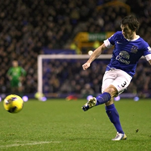 Everton's Leighton Baines in Action: Securing Victory over Wigan Athletic in the Barclays Premier League (26-12-2012)