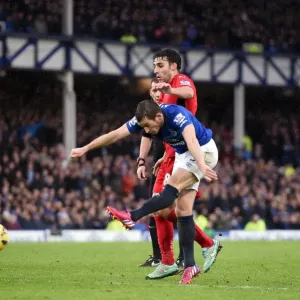 Everton's Leighton Baines Unleashes a Powerful Shot vs Leicester City at Goodison Park Everton's Leighton Baines Unleashes a Powerful Shot vs Leicester City at Goodison Park