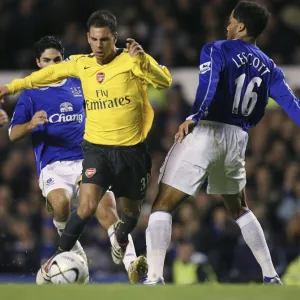 Evertons Lescott challenges Arsenals Aliadiere for the ball during their English League Cup fourth