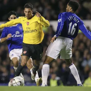 Evertons Lescott challenges Arsenals Aliadiere for the ball during their English League Cup fourth Evertons Lescott challenges Arsenals Aliadiere for the ball during their English League Cup fourth