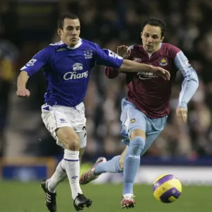 Evertons Osman challenges West Ham Uniteds Etherington for the ball during their English Premier L Evertons Osman challenges West Ham Uniteds Etherington for the ball during their English Premier L