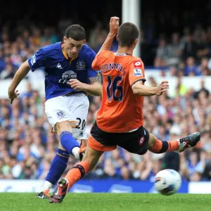 Everton's Ross Barkley Unleashes a Powerful Shot Against Queens Park Rangers (2011) Everton's Ross Barkley Unleashes a Powerful Shot Against Queens Park Rangers (2011)
