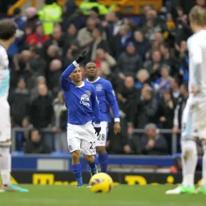 Evertons Steven Pienaar (centre) celebrates after scoring his teams opening goal