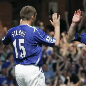 Evertons Stubbs celebrates with Carsley after scoring against Manchester United in Liverpool