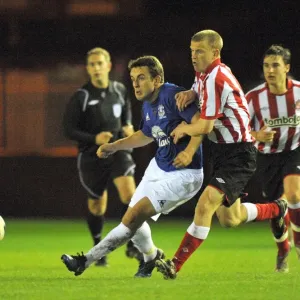 Everton's Tenacious Midfielder Jose Baxter Stands Firm Against Sunderland's Liam Bagnall