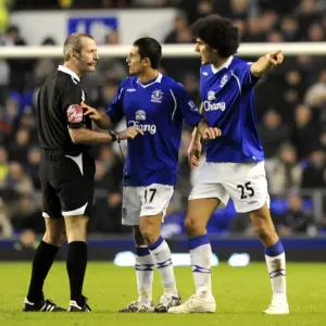 Everton's Tim Cahill and Marouane Fellaini Go Head-to-Head Against Hull City and Referee Martin Atkinson in the Barclays Premier League, 2009 Everton's Tim Cahill and Marouane Fellaini Go Head-to-Head Against Hull City and Referee Martin Atkinson in the Barclays Premier League, 2009