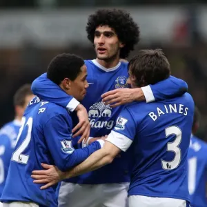 Everton's Triumph: Fellaini, Pienaar, and Baines Celebrate Goal Against Norwich City (23-02-2013)