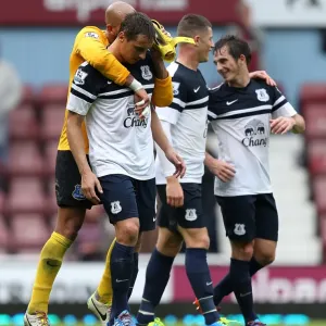 Everton's Triumph: Leighton Baines, Jagielka, and Howard Celebrate a 3-2 Win Over West Ham United (BPL 2013) Everton's Triumph: Leighton Baines, Jagielka, and Howard Celebrate a 3-2 Win Over West Ham United (BPL 2013)