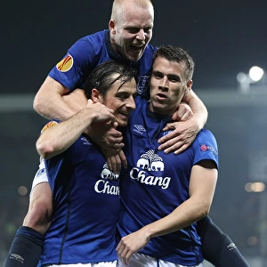 Everton's Triumphant Trio: Coleman, Baines, and Naismith Celebrate Europa League Goals vs. Wolfsburg and Krasnodar
