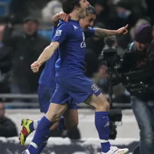 Everton's Unforgettable Double Strike: Tim Cahill and Leighton Baines Celebrate Against Manchester City (December 2010) Everton's Unforgettable Double Strike: Tim Cahill and Leighton Baines Celebrate Against Manchester City (December 2010)