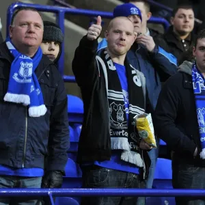 Everton's Unwavering Roar: Passionate Fans at Reebok Stadium Everton's Unwavering Roar: Passionate Fans at Reebok Stadium