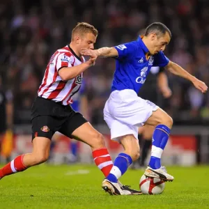 FA Cup Sixth Round Replay: Intense Battle Between Lee Cattermole and Leon Osman at Sunderland's Stadium of Light FA Cup Sixth Round Replay: Intense Battle Between Lee Cattermole and Leon Osman at Sunderland's Stadium of Light