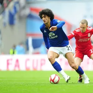 Print of Marouane Fellaini escaping Jay Spearing at Wembley Stadium Print of Marouane Fellaini escaping Jay Spearing at Wembley Stadium