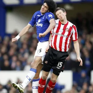 Fellaini vs Collins: Clash between Everton's Marouane Fellaini and Sunderland's Danny Collins in the Barclays Premier League Fellaini vs Collins: Clash between Everton's Marouane Fellaini and Sunderland's Danny Collins in the Barclays Premier League