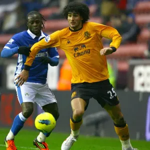 Fellaini vs. Moses: An Intense Barclays Premier League Battle at DW Stadium (04 February 2012) Fellaini vs. Moses: An Intense Barclays Premier League Battle at DW Stadium (04 February 2012)