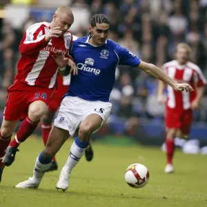 Print of Marouane Fellaini in action against Andy Wilkinson Print of Marouane Fellaini in action against Andy Wilkinson