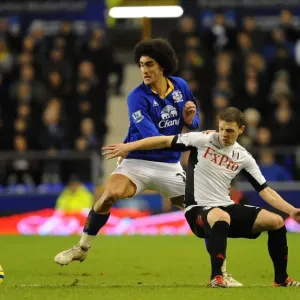 Fierce Rivalry: A Battle for the Ball - Marouane Fellaini vs. Chris Baird, Everton vs. Fulham, FA Cup Fourth Round, Goodison Park Fierce Rivalry: A Battle for the Ball - Marouane Fellaini vs. Chris Baird, Everton vs. Fulham, FA Cup Fourth Round, Goodison Park