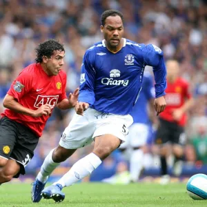 Football - Everton v Manchester United Barclays Premier League - Goodison Park - 15 / 9 / 07 Evertons Joleon Lescott (R) and Manchester Uniteds Carlos Tevez in action Mandatory Credit: Action Images / Matthew