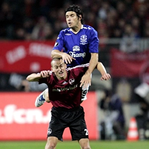 Football - FC Nurnberg v Everton UEFA Cup Group Stage - Second Round Matchday Two Group A - EasyCredit-Stadion, Nurnberg, Germany - 8 / 11 / 07 Evertons Nuno Valente in action with Nurnbergs Peer Kluge (bottom) Mandatory Credit: Action Images / Keith