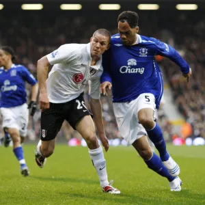 Football - Fulham v Everton Barclays Premier League - Craven Cottage - 16 / 3 / 08 Evertons Joleon Lescott and Fulhams Leon Andreasen Mandatory Credit: Action Images / John Sibley Livepic NO ONLINE / INTERNET USE WITHOUT A LICENCE FROM THE FOOTBA