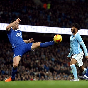 Gareth Barry vs Raheem Sterling: Intense Battle for the Ball in Everton vs Manchester City Capital One Cup Semi-Final