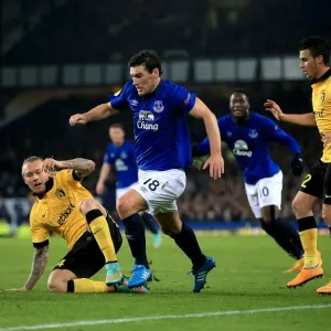 Gareth Barry vs. Simon Kjaer: A Battle for the Ball in Everton vs. Lille UEFA Europa League Clash