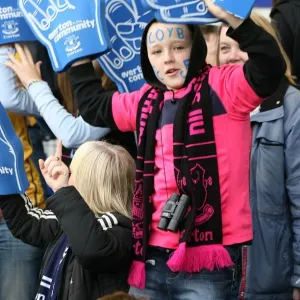 Half-Time Thrills: A Young Everton Fan's Excitement with Giant Foam Hands at Goodison Park