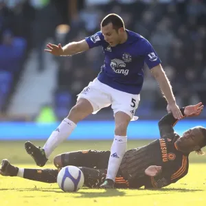 Heating Up the Pitch: A Fierce Battle Between Heitinga and Drogba in the FA Cup Fourth Round Clash between Everton and Chelsea (29 January 2011) Heating Up the Pitch: A Fierce Battle Between Heitinga and Drogba in the FA Cup Fourth Round Clash between Everton and Chelsea (29 January 2011)