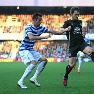 Intense Battle for Ball Possession: Baines vs. Isla, Queens Park Rangers vs. Everton Intense Battle for Ball Possession: Baines vs. Isla, Queens Park Rangers vs. Everton
