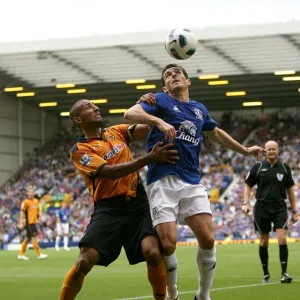 Intense Battle for Ball Possession: Baines vs. Henry Intense Battle for Ball Possession: Baines vs. Henry