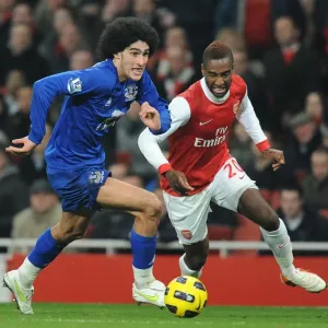 Intense Battle for Ball Possession: Fellaini vs. Djourou - Arsenal vs. Everton, Barclays Premier League (February 2011) Intense Battle for Ball Possession: Fellaini vs. Djourou - Arsenal vs. Everton, Barclays Premier League (February 2011)