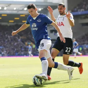 Intense Battle for Ball Possession: Gareth Barry vs. Nacer Chadli - Everton vs. Tottenham, Premier League, Goodison Park Intense Battle for Ball Possession: Gareth Barry vs. Nacer Chadli - Everton vs. Tottenham, Premier League, Goodison Park