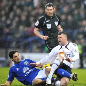 Intense Battle for Ball Possession: Mikel Arteta vs. Paul Robinson, Everton vs. Bolton Wanderers (Barclays Premier League, 13 February 2011, Reebok Stadium) Intense Battle for Ball Possession: Mikel Arteta vs. Paul Robinson, Everton vs. Bolton Wanderers (Barclays Premier League, 13 February 2011, Reebok Stadium)