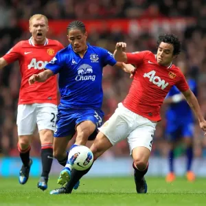 Intense Battle for Ball Possession: Rafael Da Silva vs. Steven Pienaar (Manchester United vs. Everton, Barclays Premier League, Old Trafford, 22 April 2012) Intense Battle for Ball Possession: Rafael Da Silva vs. Steven Pienaar (Manchester United vs. Everton, Barclays Premier League, Old Trafford, 22 April 2012)