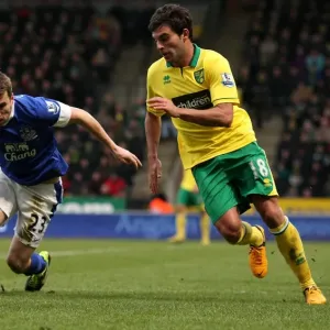 Intense Battle for Ball Possession: Seamus Coleman vs. Javier Garrido - Norwich City vs. Everton, Premier League (February 23, 2013)
