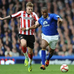 Intense Battle for FA Cup Possession: Bendtner vs. Distin at Goodison Park (Everton vs. Sunderland, 17 March 2012) Intense Battle for FA Cup Possession: Bendtner vs. Distin at Goodison Park (Everton vs. Sunderland, 17 March 2012)