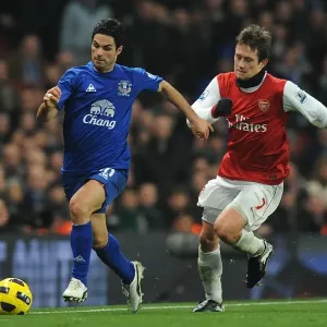 Intense Battle: Mikel Arteta Evades Tomas Rosicky at Emirates Stadium - Arsenal vs. Everton, Barclays Premier League (February 2011) Intense Battle: Mikel Arteta Evades Tomas Rosicky at Emirates Stadium - Arsenal vs. Everton, Barclays Premier League (February 2011)