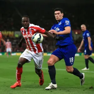 Intense Battle for Possession: Gareth Barry (Everton) vs. Victor Moses (Stoke City) in the Barclays Premier League Intense Battle for Possession: Gareth Barry (Everton) vs. Victor Moses (Stoke City) in the Barclays Premier League