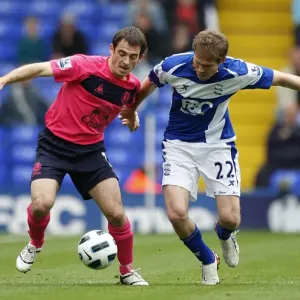 Intense Rivalry: Baines vs. Hleb Battle for Ball at St. Andrews, October 2010 Intense Rivalry: Baines vs. Hleb Battle for Ball at St. Andrews, October 2010