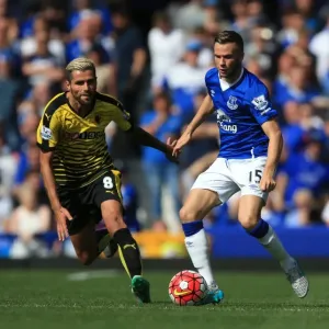 Intense Rivalry: Cleverley vs Behrami's Battle for Ball Possession (Everton vs Watford, Premier League) Intense Rivalry: Cleverley vs Behrami's Battle for Ball Possession (Everton vs Watford, Premier League)