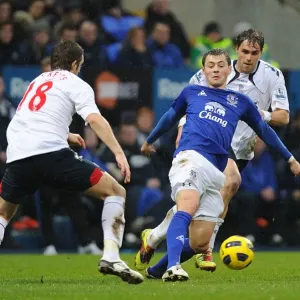 Intense Rivalry: Coleman vs. Ricketts Battle for Ball - Everton vs. Bolton Wanderers, Premier League (February 13, 2011) Intense Rivalry: Coleman vs. Ricketts Battle for Ball - Everton vs. Bolton Wanderers, Premier League (February 13, 2011)